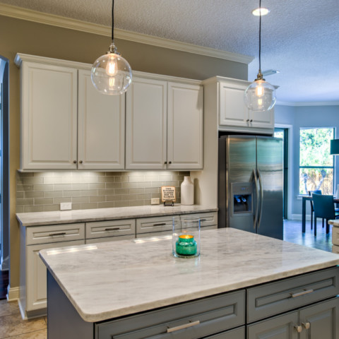 before and after light gray kitchen cabinets painted