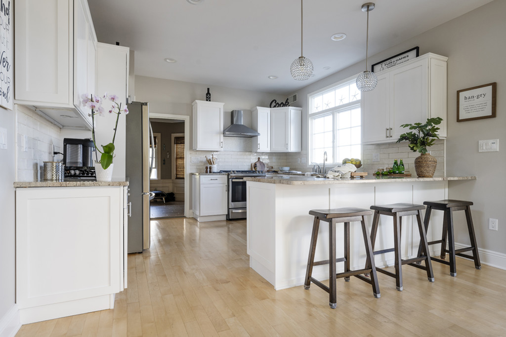 a Large kitchen after cabinet painting in duxbury