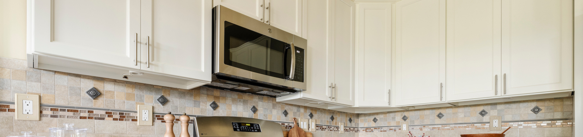 Photo of kitchen with blue and white refinished cabinets