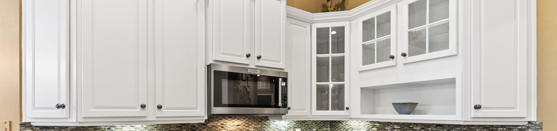 Photo of kitchen with blue and white refinished cabinets