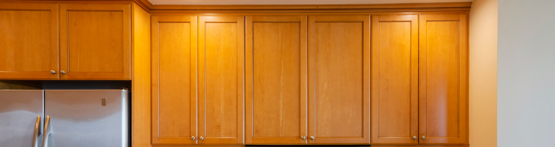 Photo of kitchen with old cabinets before refinishing