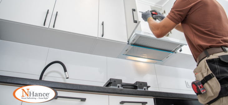 Man adding kitchen cabinet hardware