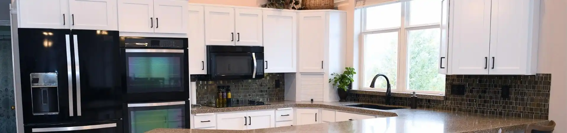 Photo of kitchen with blue and white refinished cabinets