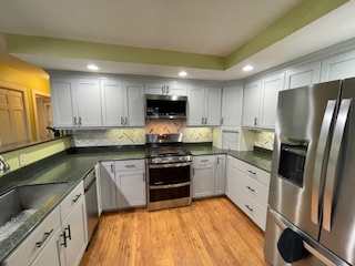 white refinished cabinets