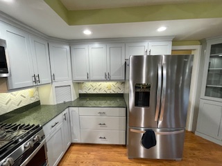 white refinished cabinets