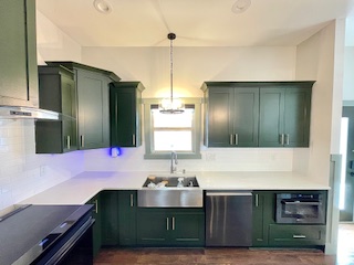 updated, modern cabinets in a green color